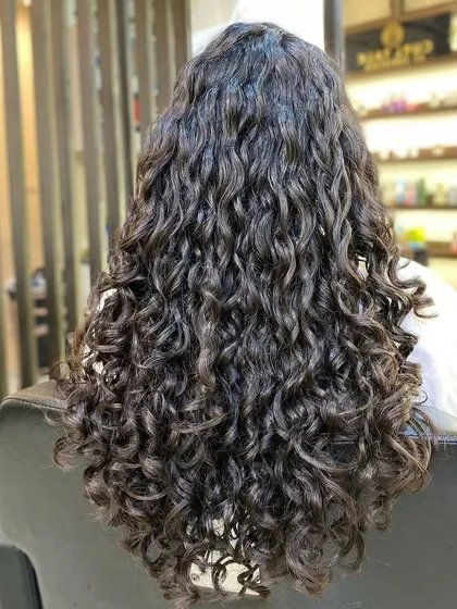 This is what I call HAIR GOALS. For clients with long hair, my focus is on creating shape and definition through strategic layering, eliminating frizz and revealing beautiful, cascading curls.