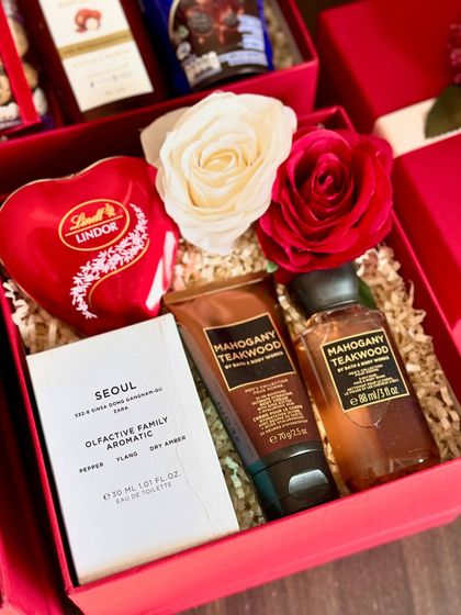 "All Things Love" in one box. This Valentine's hamper features a Lindt heart box, a Zara mini perfume, and matching "Mahogany Teakwood" mini body cream and shower gel from Bath & Body Works.