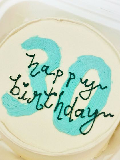 A minimalist bento cake for a 30th birthday with a cool, textured number design. It’s a modern and stylish way to mark the milestone.