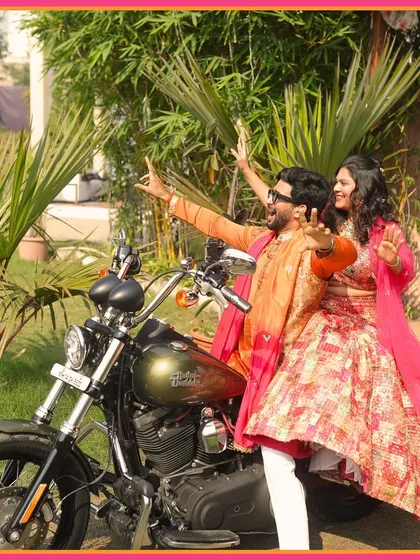 Making a grand entrance on a Harley Davidson. This couple brought their cool and edgy style to their Mehendi ceremony.