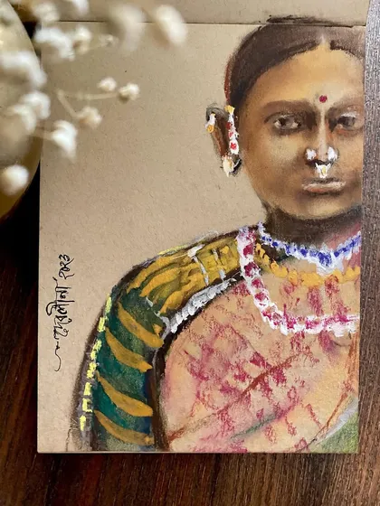 Titled "Aurat" (Woman), this is a small portrait created using mixed media on tanned paper. The texture of the paper adds a rustic and earthy quality to the artwork.