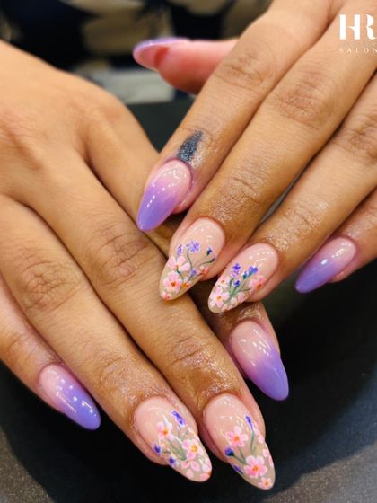 Another angle of this stunning purple ombre and floral nail art. The almond shape of the nails elongates the fingers, while the detailed artwork makes this a truly special design.