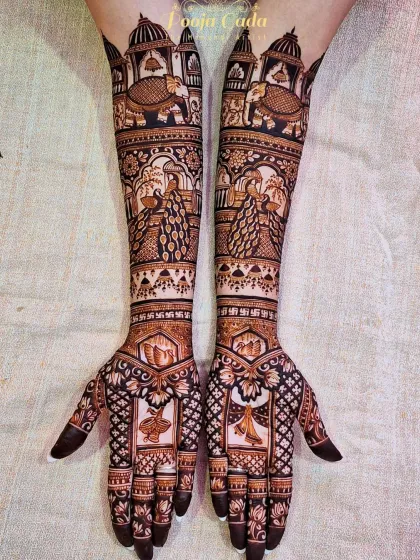 For brides who prefer timeless elegance without human figures, I create rich, elaborate patterns. This design is a perfect example, featuring majestic elephants, royal peacocks, and intricate architectural domes for a truly regal look.