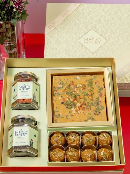 This is where tradition meets modern elegance. My premium gift hampers, like this one featuring artisanal mithai, laddoos, and savory nuts, are thoughtfully curated and beautifully packaged to make your festive gifting truly special.