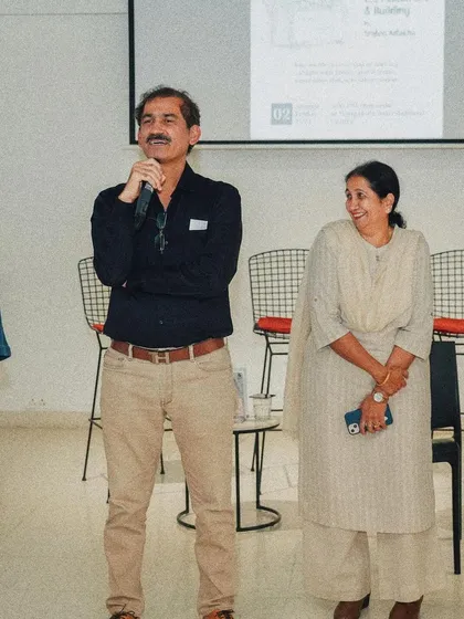 A moment of celebration during the book launch event, surrounded by our team, friends, and professional associates who have been part of our journey.