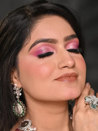 A close-up of a sharp pink cut-crease I created for a beauty shoot. This technique requires precision and is perfect for highlighting the eyes in a dramatic, high-fashion context. I paired it with a glossy nude lip to balance the look.