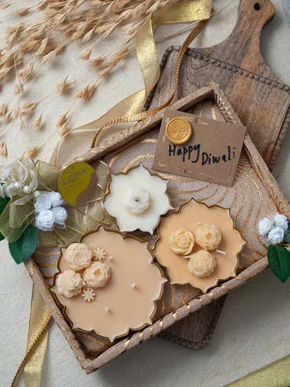 This beautiful Diwali hamper features a collection of my floral-scented candles in a decorative tray, complete with a "Happy Diwali" tag.