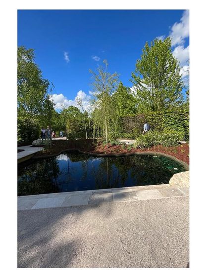 Visitors can be seen in the distance enjoying the garden. Seeing our designs being used and appreciated is the most fulfilling part of the process, confirming that we have created a space that resonates with people.