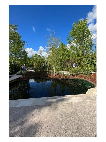 Visitors can be seen in the distance enjoying the garden. Seeing our designs being used and appreciated is the most fulfilling part of the process, confirming that we have created a space that resonates with people.
