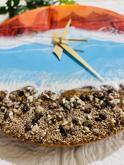 A close-up on the textured shore of my Jagannath Puri wall clock, crafted with real sand and stones to bring the feeling of the holy city's coastline right into your home.
