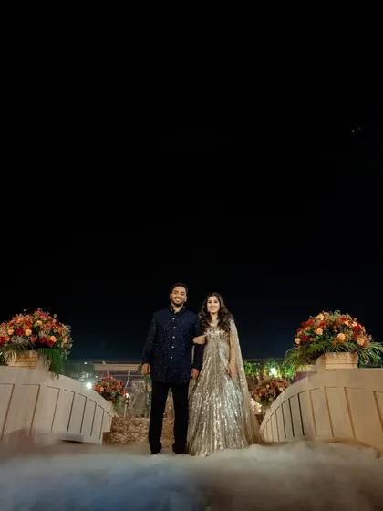 Romance built on history. For this 'Lost City' themed event, I constructed a grand Roman bridge over a water body, providing a dramatic and unforgettable setting for the couple's ring ceremony, surrounded by mist and ancient wonder.