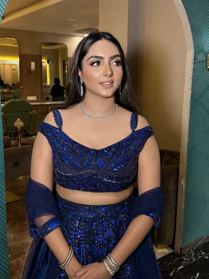 A side profile of this beautiful look. The makeup is flawless from every angle.