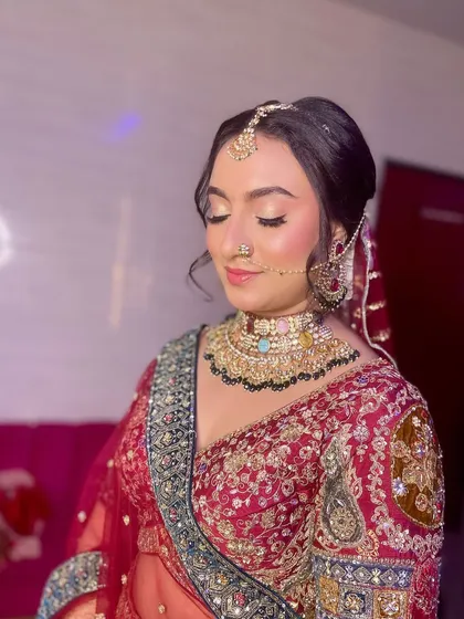A close-up of a bride's makeup, featuring a soft cut-crease eyeshadow and a flawless base.
