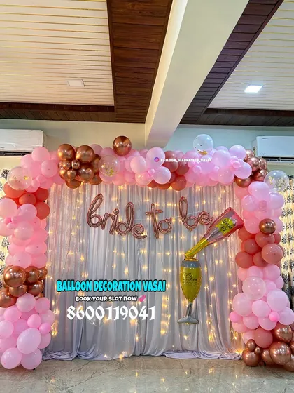 We love creating fun and feminine backdrops for bridal showers. This arch uses shades of pink and rose gold for a glamorous and exciting party vibe.