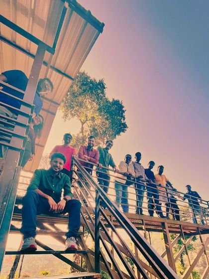 A cool group pose on a watchtower in Coorg, offering great views of the surrounding forest.