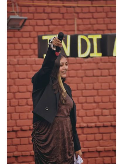 Raising the mic in triumph after a high-energy segment. That feeling of a hyped-up crowd is the best reward.