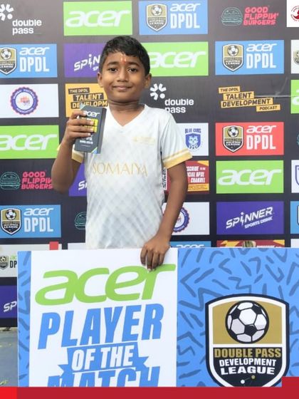 Om Kale of the U-10 team with his Man of the Match award after scoring an impressive four goals.