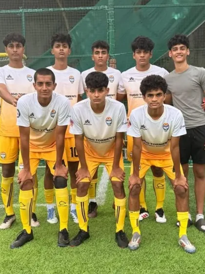 Our U-17 team in their yellow and white kits, lined up and ready for a match in Goa.