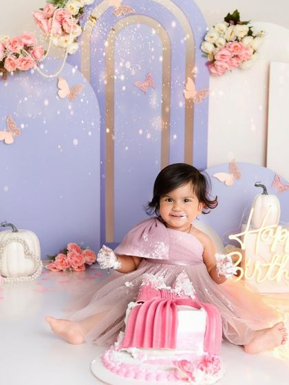 A butterfly-themed first birthday for a beautiful little girl. The soft pastel colors, floral details, and of course, the messy cake, made this a truly magical cake smash session.
