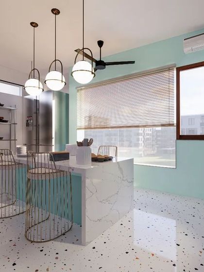 This view of the baking studio shows the balance between function and aesthetics. A fixed skylight brings in optimal sunlight for the afternoon, while the open storage racks keep supplies accessible. The central marble island with its sleek bar chairs serves as both a workspace and a place to host classes.
