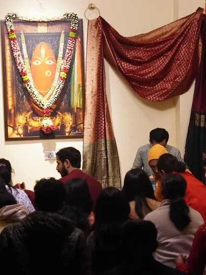 After the main rituals, people often stay to sit in the charged atmosphere. The space remains open for anyone to quietly soak in Devi's grace.