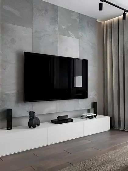 This is an example of our minimalist design approach. A simple white floating console provides clean, handle-less storage, while the large-format tile wall and vertical LED strip lighting add texture and depth without clutter.