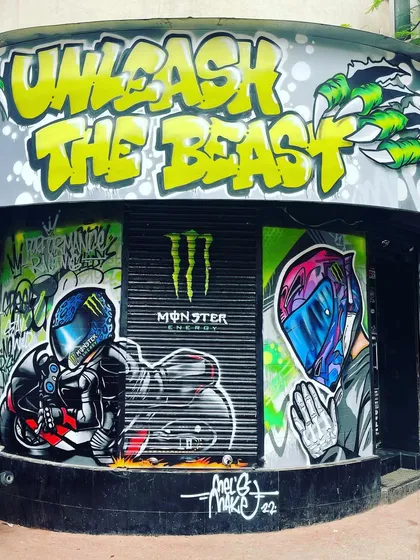 This is a full-frontal look at the storefront I transformed for the Performance Racing store, a project in collaboration with Monster Energy. I used my signature graffiti style to create an unmissable facade with the "Unleash The Beast" tagline, giving the shop serious street cred.