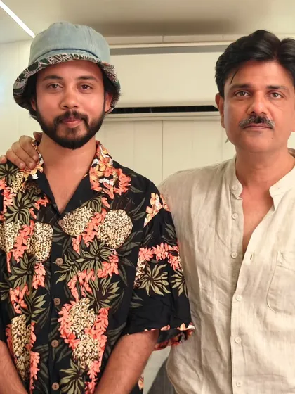 With a fellow crew member. The long hours and chaos of a film set bring everyone together like a family.