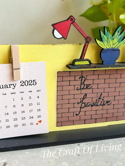 "Be Positive." This wooden desk calendar features a motivational message against a brick wall design, a great daily reminder to stay optimistic.