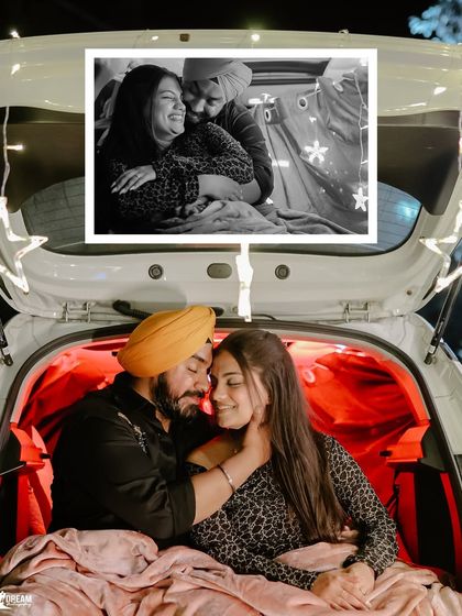 A cozy and intimate moment in the decorated trunk of a car, with fairy lights adding a magical glow to this unique pre-wedding photo.