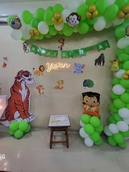 A fun jungle-themed party for Yuvan's 7th birthday, featuring characters like Sher Khan and Chhota Bheem. I created a green and white balloon arch with animal print accents and placed large character cutouts to make the kids feel like they're in a real jungle adventure.