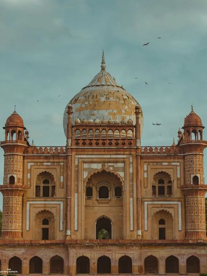 A straight-on, symmetrical shot of Safdarjung Tomb. This classic composition highlights the incredible detail and balance of Mughal architecture.