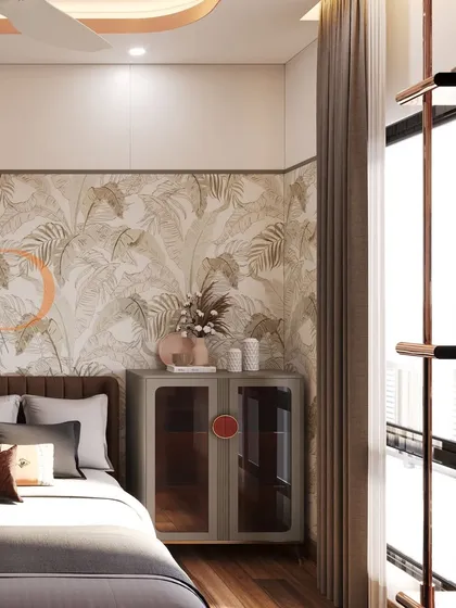 A modern bedroom with a botanical-patterned accent wall, a sleek grey cabinet, and large windows that fill the space with natural light.