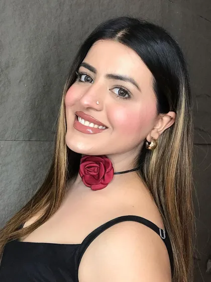 A smiling shot of the natural, no-foundation makeup look. This demonstrates that you can achieve a polished and glowing look with minimal products.