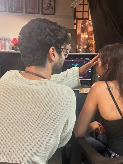 A quiet moment on the set of the music video 'Razdariyan'. As a costume stylist, a lot of my job is watching the monitor to ensure every detail of the wardrobe looks perfect on camera and supports the story.