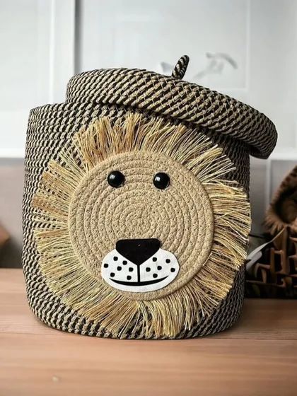 This lion-faced laundry basket adds a playful touch to any room. It's made from durable woven rope and comes with a lid to keep things tidy.