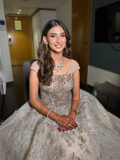 Effortless beauty for Yashvi's Sangeet. We went for a soft glam look with gentle waves in her hair, making her look like a princess in her silver gown.