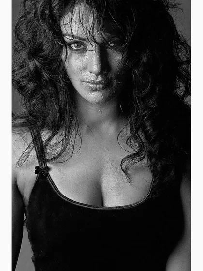 A black and white studio portrait of Indian actress and model Shwetha Menon, captured in 2002. This image showcases my signature intense and raw portrait style, focusing on her expressive features.