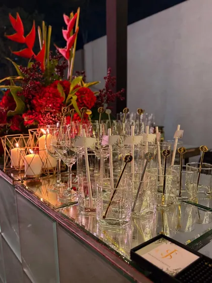 Our bar is always impeccably set with beautiful glassware, custom stirrers, and elegant floral arrangements. We ensure every detail is perfect before the first guest arrives.