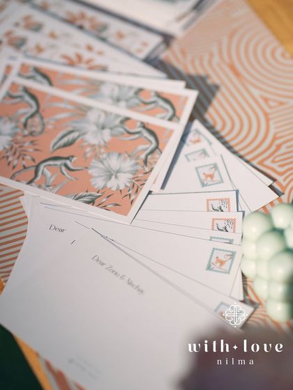 A guest message station at 'The Conservatory' baby shower, with custom postcards for guests to leave their wishes.