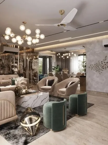 An opulent living area where different textures and finishes create a rich sensory experience. From the fluted glass partitions and marble-topped coffee table to the plush, velvety seating, every element is chosen to contribute to an atmosphere of modern luxury.