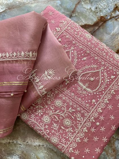 A folded view of the suit, emphasizing the rich texture of the silk chanderi and the detailed embroidery.