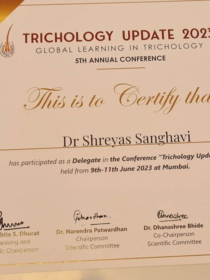 My certificate of participation from the Trichology Update 2023 conference. This event focused on global learning in the science of hair and scalp health, which is central to my practice.
