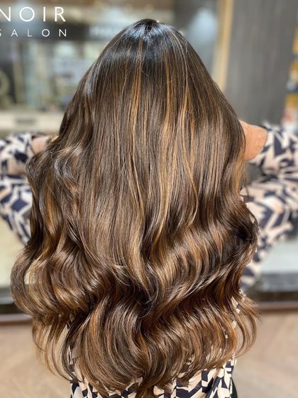 Another angle of this gorgeous brunette balayage. You can see how the light catches the different tones, creating a rich, dimensional effect.