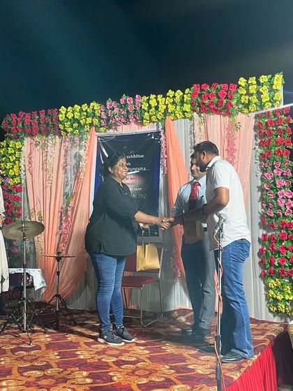 Receiving a token of appreciation from the event organizers. It's always a privilege to share my knowledge and passion for dog behavior with a wider audience.