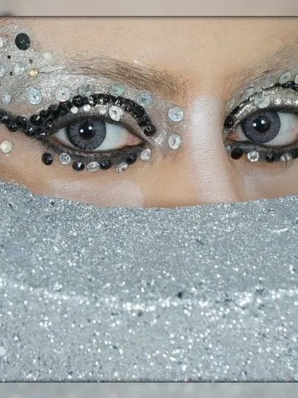 This is a high-fashion, couture-inspired eye makeup look, using sequins and crystals to create texture and drama. This demonstrates my technical skill in intricate, avant-garde makeup application for runway and editorial concepts.