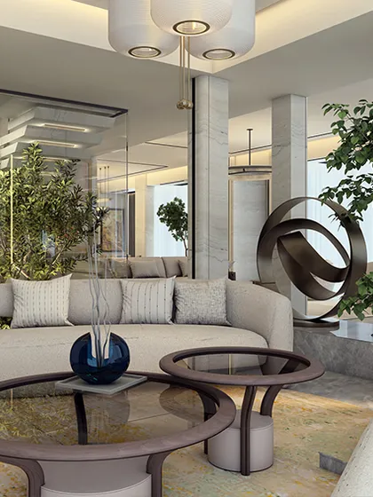 This living room at Indiabulls Sky Forest prioritizes openness and light. A sculptural art piece and indoor greenery are framed by full-height windows, while the neutral palette is thoughtfully restrained, allowing personal expression to take center stage.