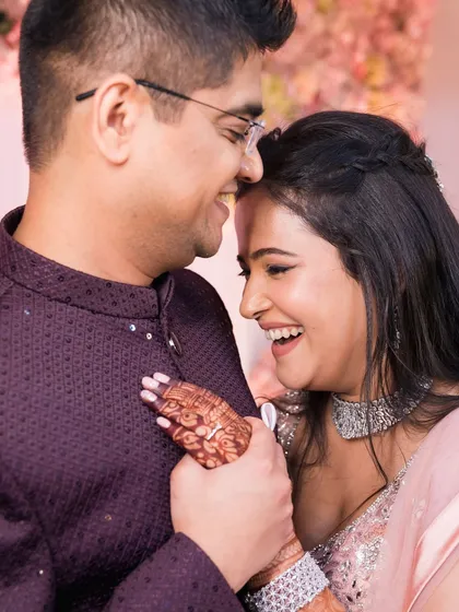 An intimate close-up of a couple sharing a laugh.