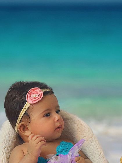My little mermaid! This creative sitter session uses a beach backdrop to bring a magical underwater fantasy to life right here in the studio.