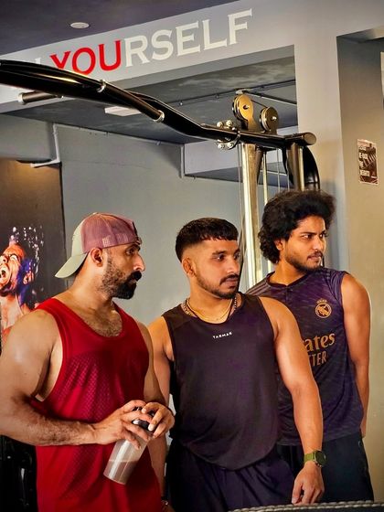 We are a team, unstoppable together. Here I am with two of my clients at Throne Fit, discussing our next set. The community and camaraderie we build are just as important as the weights we lift.